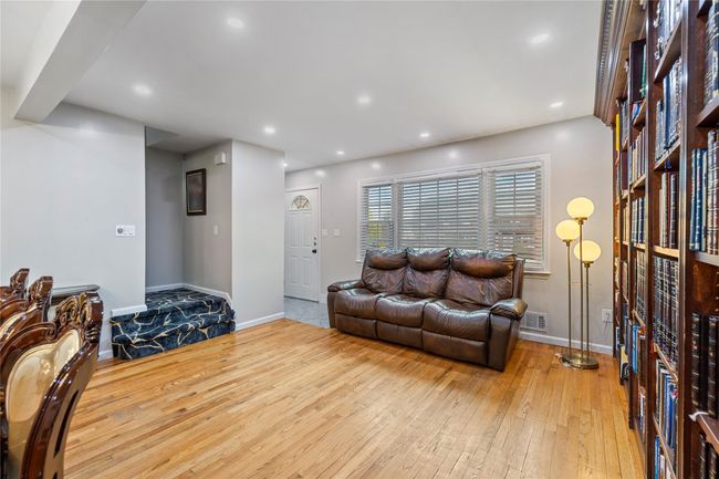 Living area featuring baseboards, visible vents, recessed lighting, and wood-type flooring | Image 4