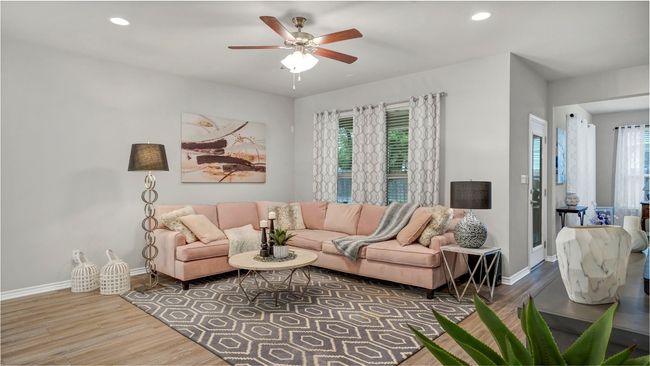 Living room featuring a ceiling fan, baseboards, recessed lighting, and wood finished floors | Image 11