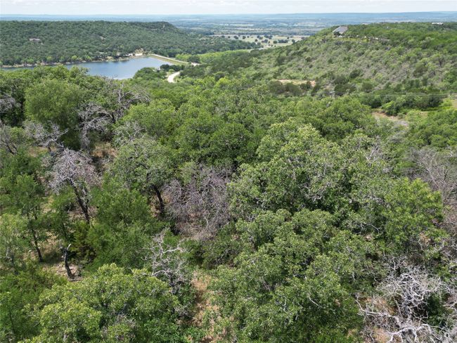 Birds eye view of property with a water view and a forest view | Image 17