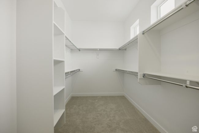 Walk in closet with light colored carpet | Image 32