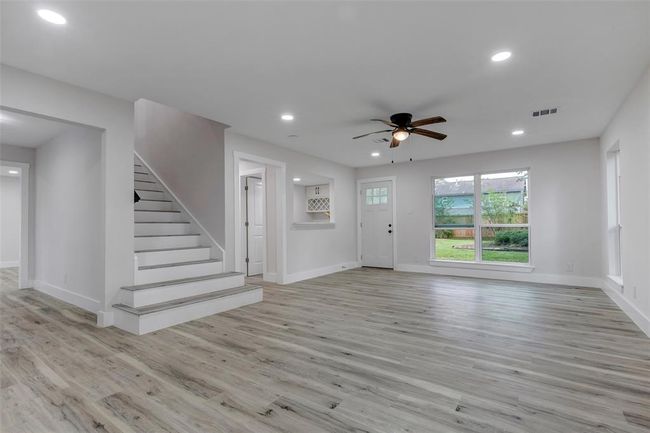 New Vinyl flooring in the living room and throughout the whole house for easy maintenance. | Image 6