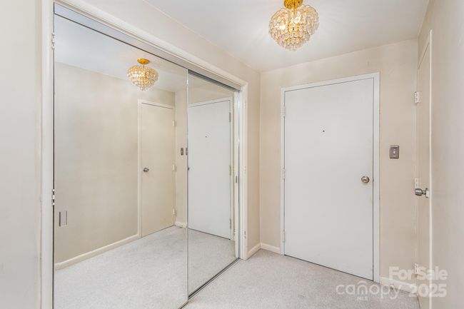 Entrance way has 3 closets | Image 5