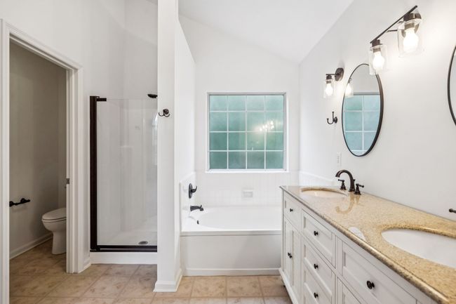 Primary Bathroom with Dual Vanities, Shower, and Soaking Tub | Image 38