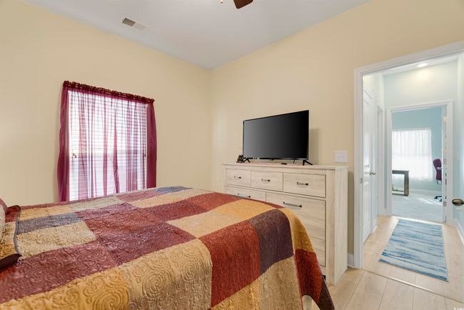 Bedroom with ceiling fan and light hardwood / wood-style floors | Image 26
