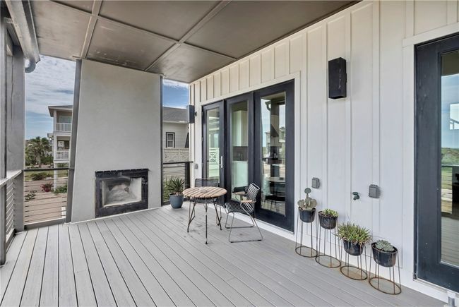 Front entry deck with fireplace. | Image 5