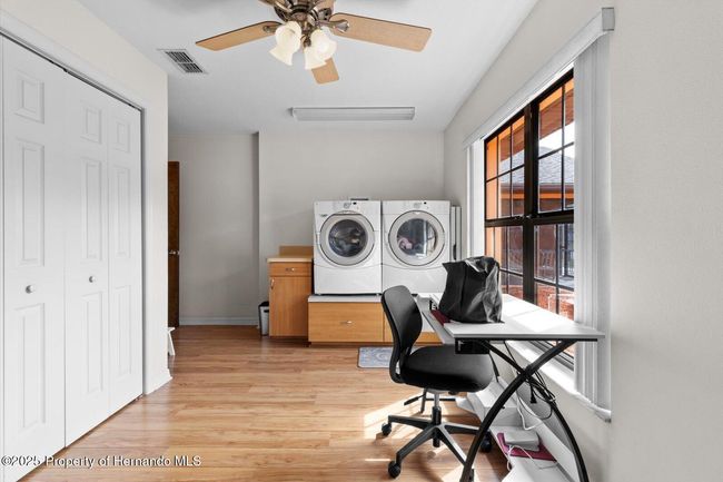 Laundry Room connecting the main house to the suite | Image 24