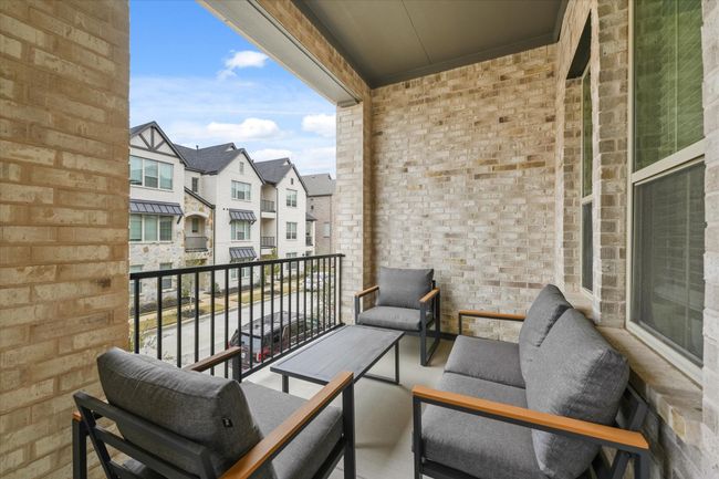 Balcony with a residential view and outdoor lounge area | Image 30