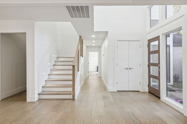 Foyer featuring stairway, baseboards, visible vents, recessed lighting, and light wood-type flooring | Image 9