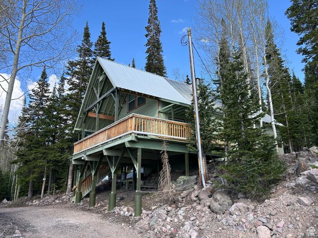 View of front of property with a deck and a metal roof | Image 9