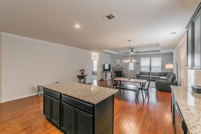 open kitchen with light stone counters | Image 17