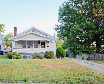 View of front of home with a front lawn | Image 1