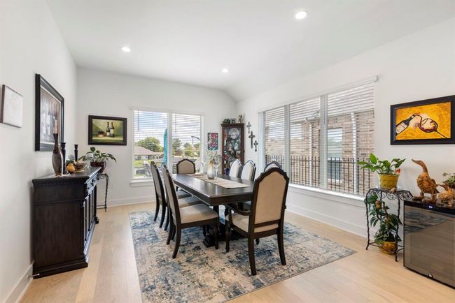 Bright dining area with stunning lake views. | Image 22