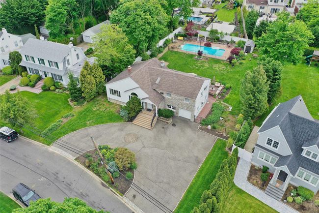 Aerial view of residential area with a pool area | Image 26