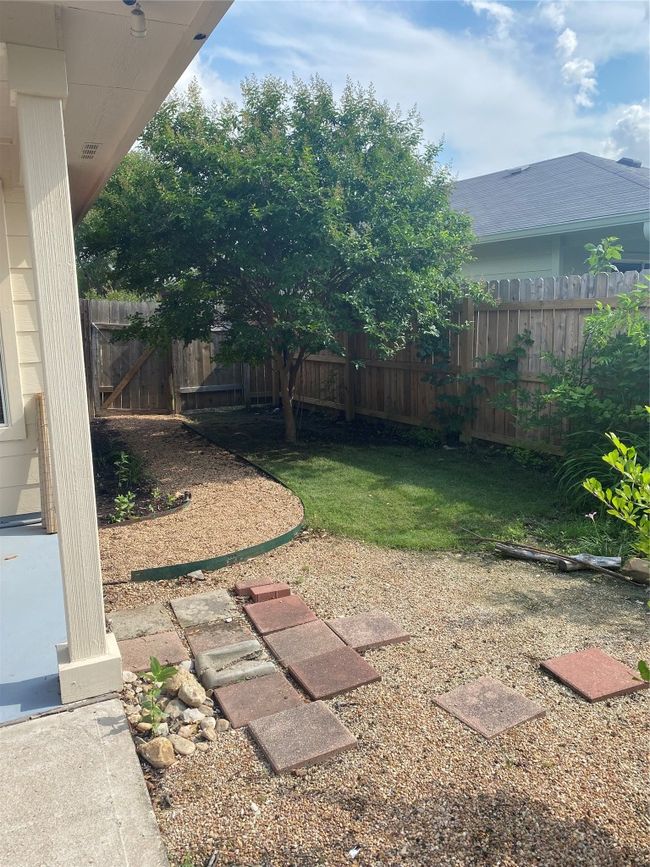 View of yard with fence | Image 17