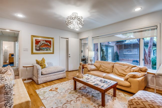 Living room with light wood-type flooring | Image 5