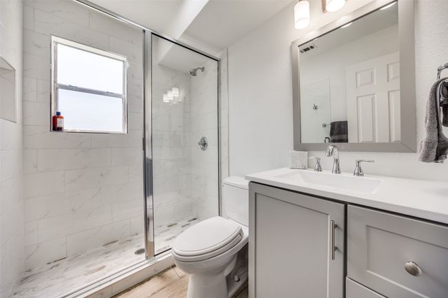 Full bathroom with a shower stall and vanity | Image 15