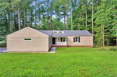 View of front facade with a front lawn | Image 2