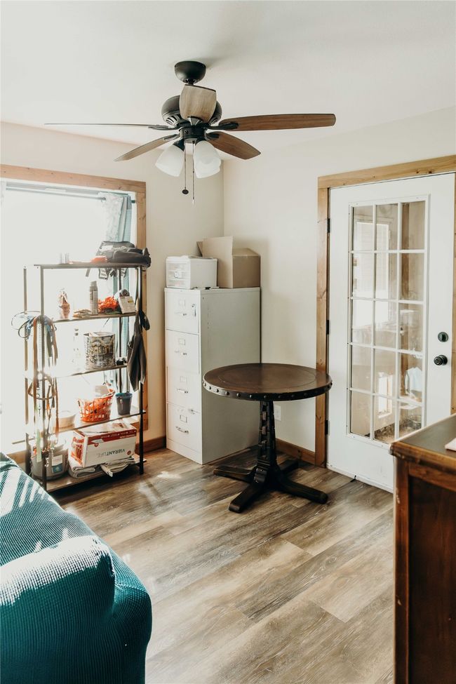 Bedroom with wood finished floors | Image 27