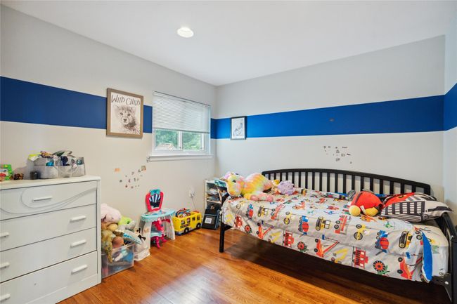 Bedroom featuring light wood finished floors | Image 13