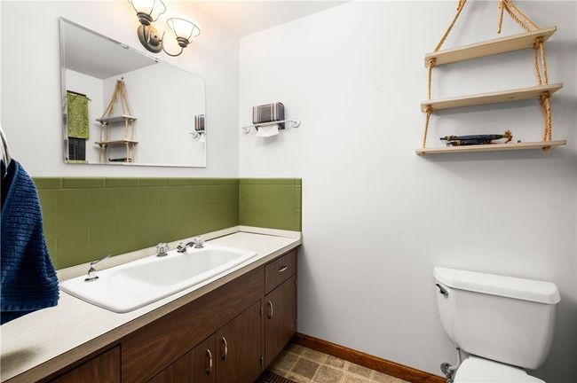 1/2 BATH JUST INSIDE THE BACK ENTRANCES OF THE HOME | Image 13