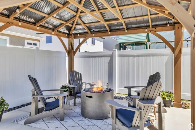 View of patio / terrace featuring a gazebo and an outdoor fire pit | Image 32