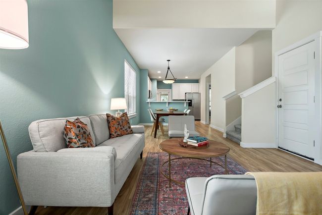 The connection to the dining nook and kitchen keeps everything flowing, while still feeling like its own defined space | Image 8