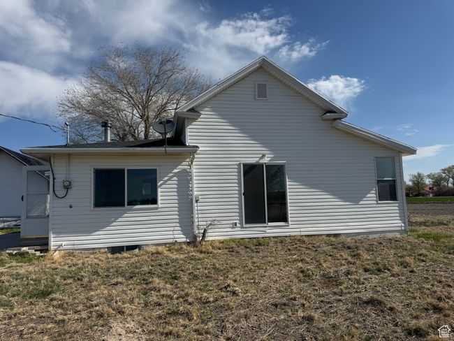 Rear view of house with a lawn | Image 12