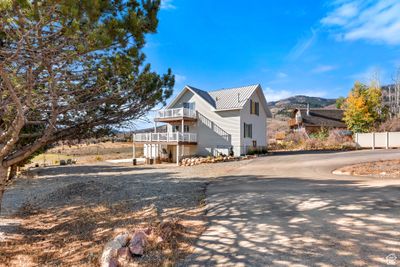 View of front of home with a balcony and a mountain view | Image 2