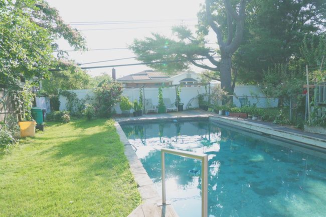 View of swimming pool featuring a fenced backyard | Image 20