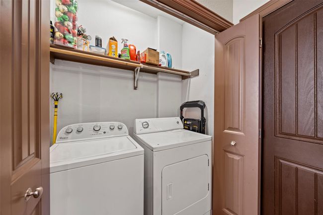 Laundry area featuring washer and clothes dryer | Image 6