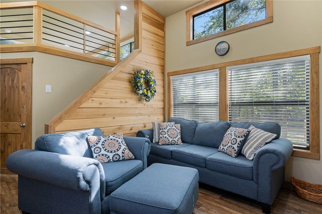 Living room with wood finished floors | Image 12