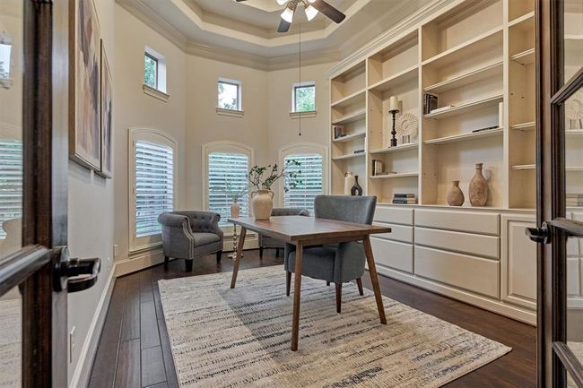 Beautiful office with built-ins and plantation shutters. | Image 6