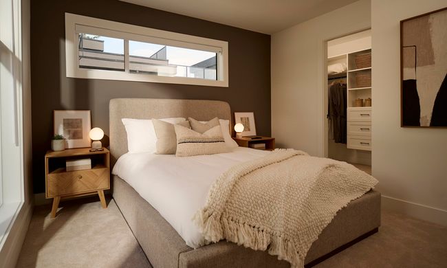 Bedroom with a closet, carpet floors, baseboards, and a walk in closet | Image 7