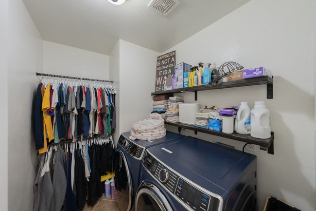 Laundry area with washer and clothes dryer | Image 28