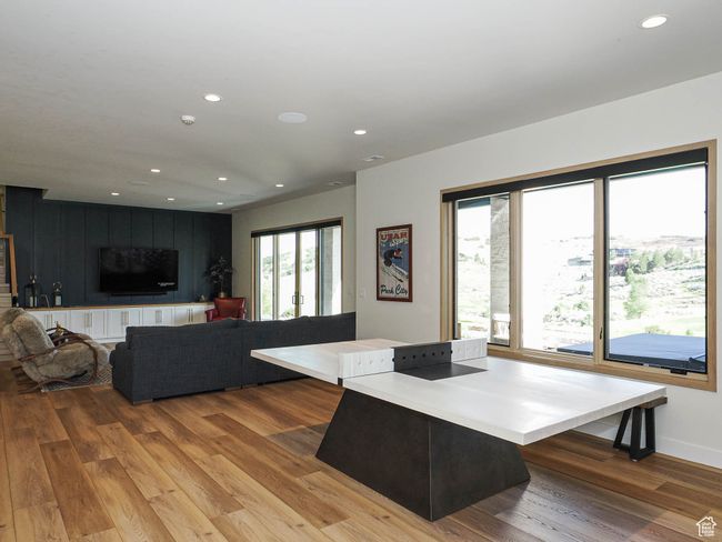 Living area featuring wood finished floors and recessed lighting | Image 74
