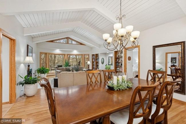 Living room has an abundance of windows allowing for natural lighting and beautiful views of the backyard and river frontage! | Image 8