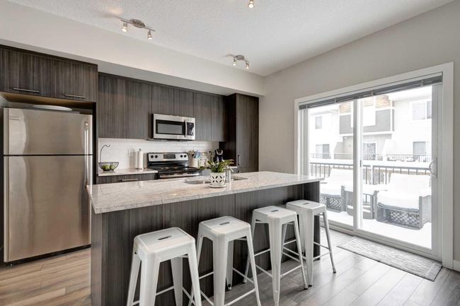 107 - 2802 Kings Heights Gate Se, Home with 3 bedrooms, 2 bathrooms and 2 parking in Airdrie AB | Image 9