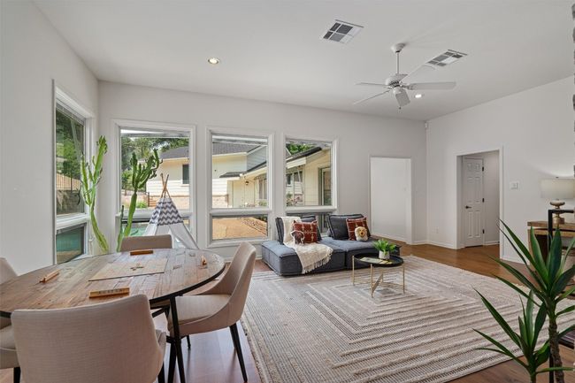 Opening leads to guest bedroom with en suite bath. Hallway leads to an incredible office and climate controlled storage. | Image 23