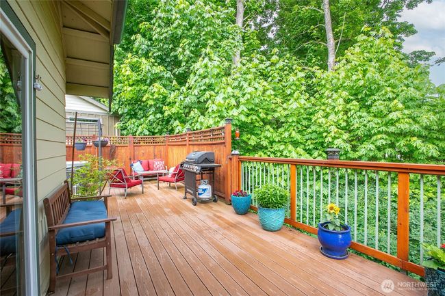 Deck off living room faces greenspace | Image 23