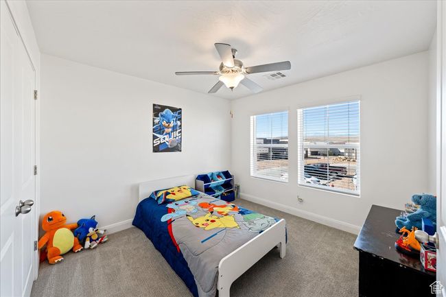 Carpeted bedroom with baseboards and ceiling fan | Image 25