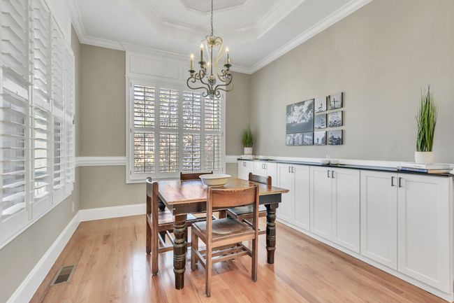 The sunny breakfast room has built-in cabinetry for even more storage and organization! | Image 21