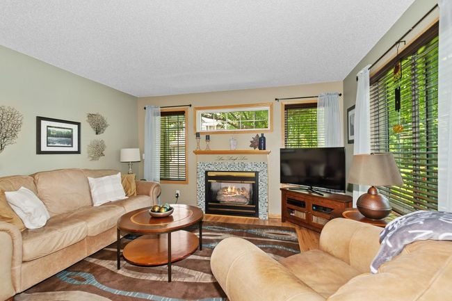 Relax in Comfort with lots of natural light and a cozy fireplace | Image 4
