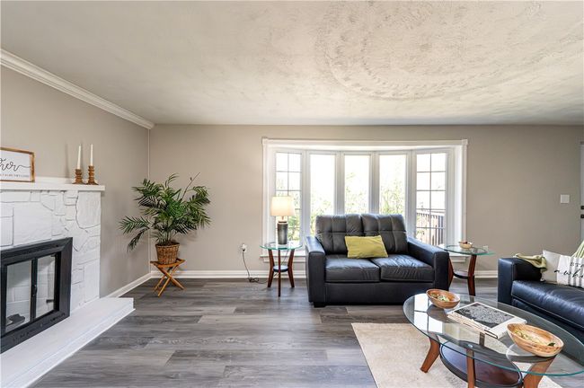 The luxury floating floor and current paint palette create a warm inviting atmosphere! | Image 9