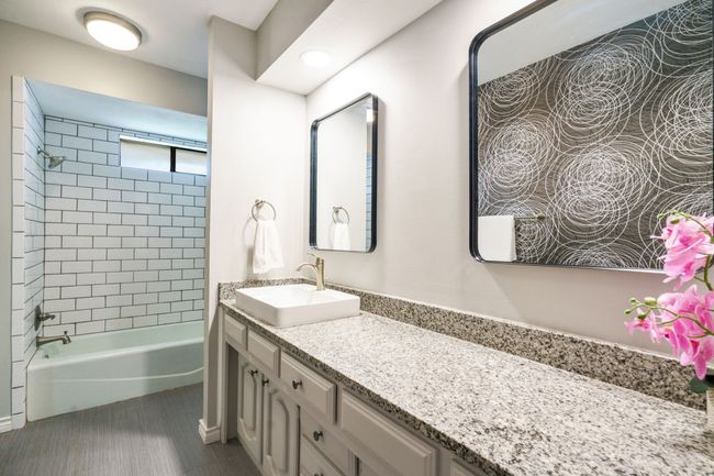 Full bathroom featuring vanity and shower / bathtub combination | Image 21