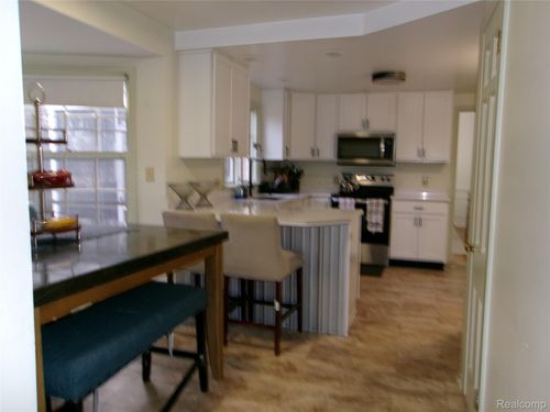 1682 Woodside Dr, East Lansing, MI, 48823-2958 | Card Image