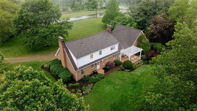 Aerial view of property and surrounding area featuring a tree filled landscape | Image 36