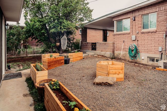View of patio / terrace featuring a vegetable garden | Image 4