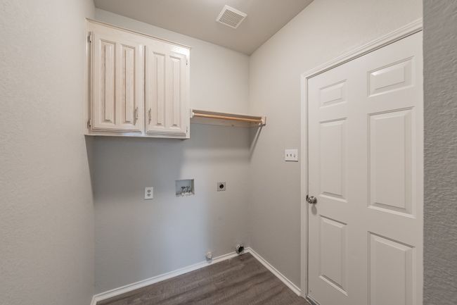Laundry area with space for full size washer & dryer leads to the two car garage. | Image 35