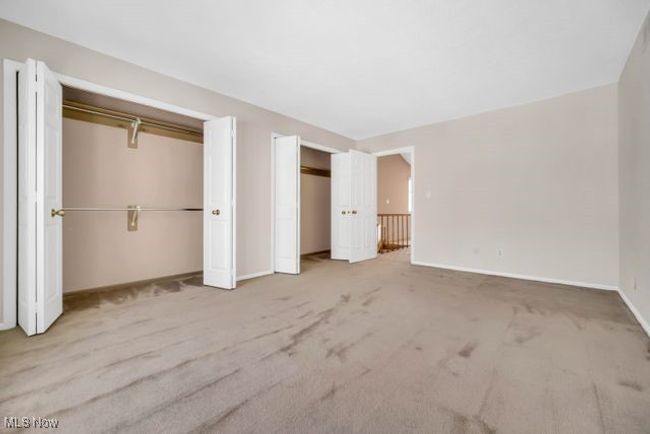 Large second floor bedroom has double closets | Image 34