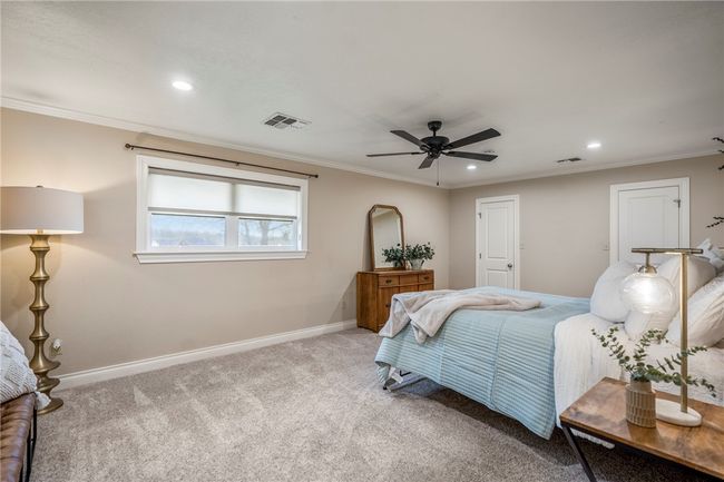 Carpeted bedroom featuring recessed lighting, visible vents, crown molding, and baseboards | Image 22